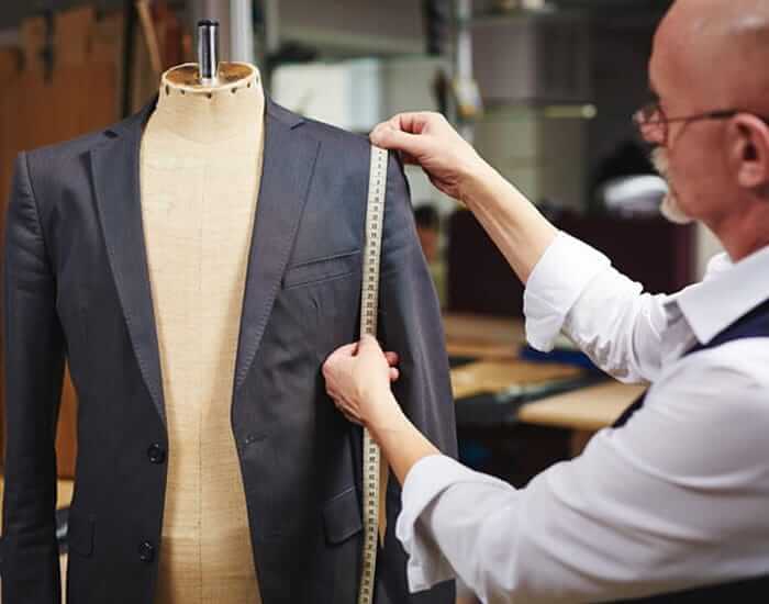 Tailor taking precise measurements