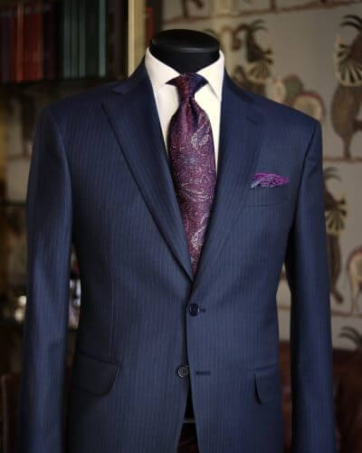 Man in a classic navy bespoke suit